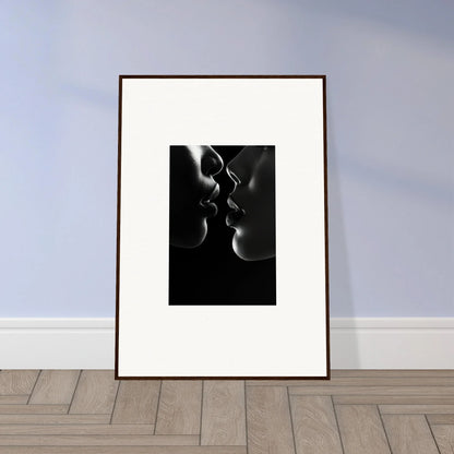 Framed wall art of a midnight kiss darkness with silhouetted profiles about to kiss