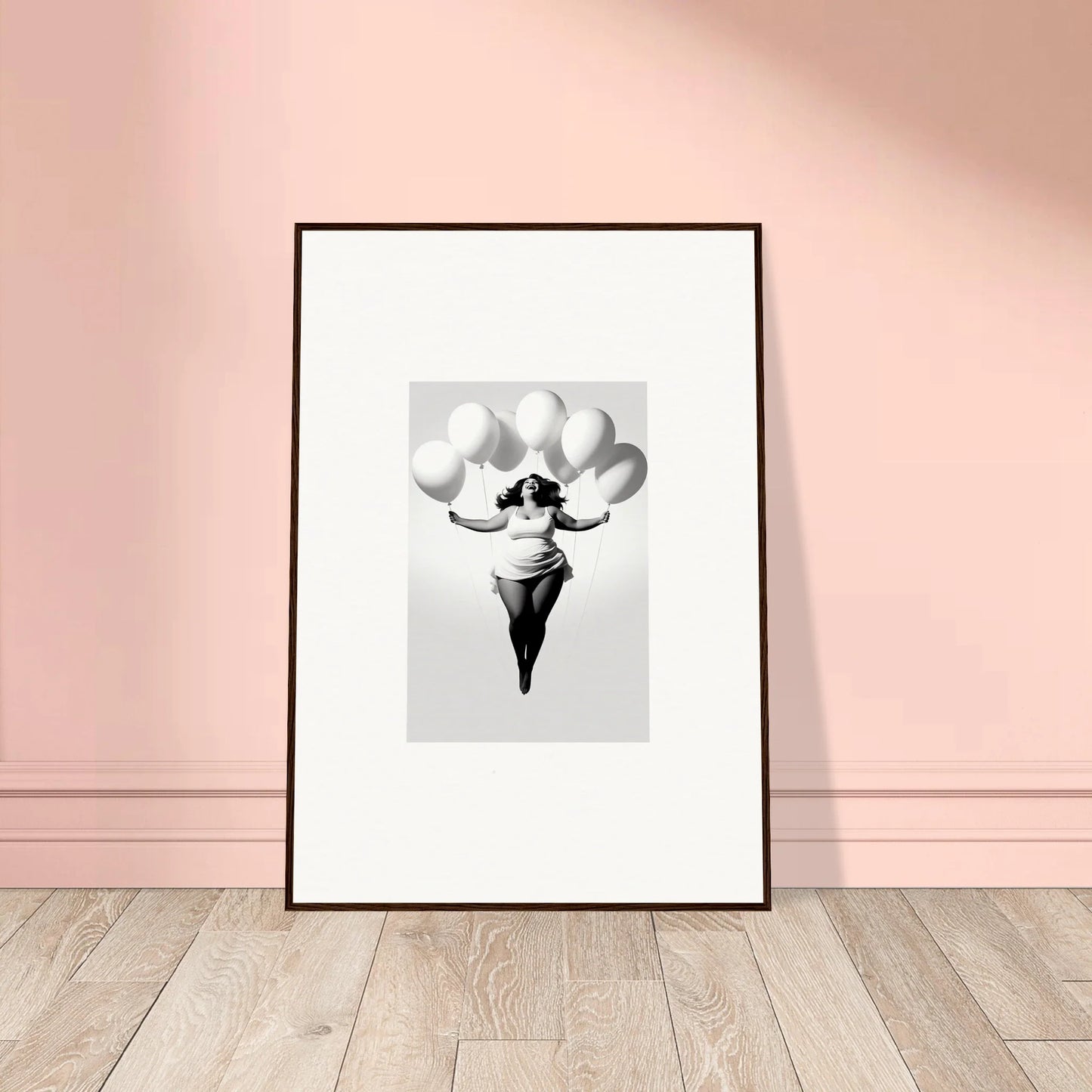 Framed wall art of Rosy Liberties Soar, featuring a figure with white balloons