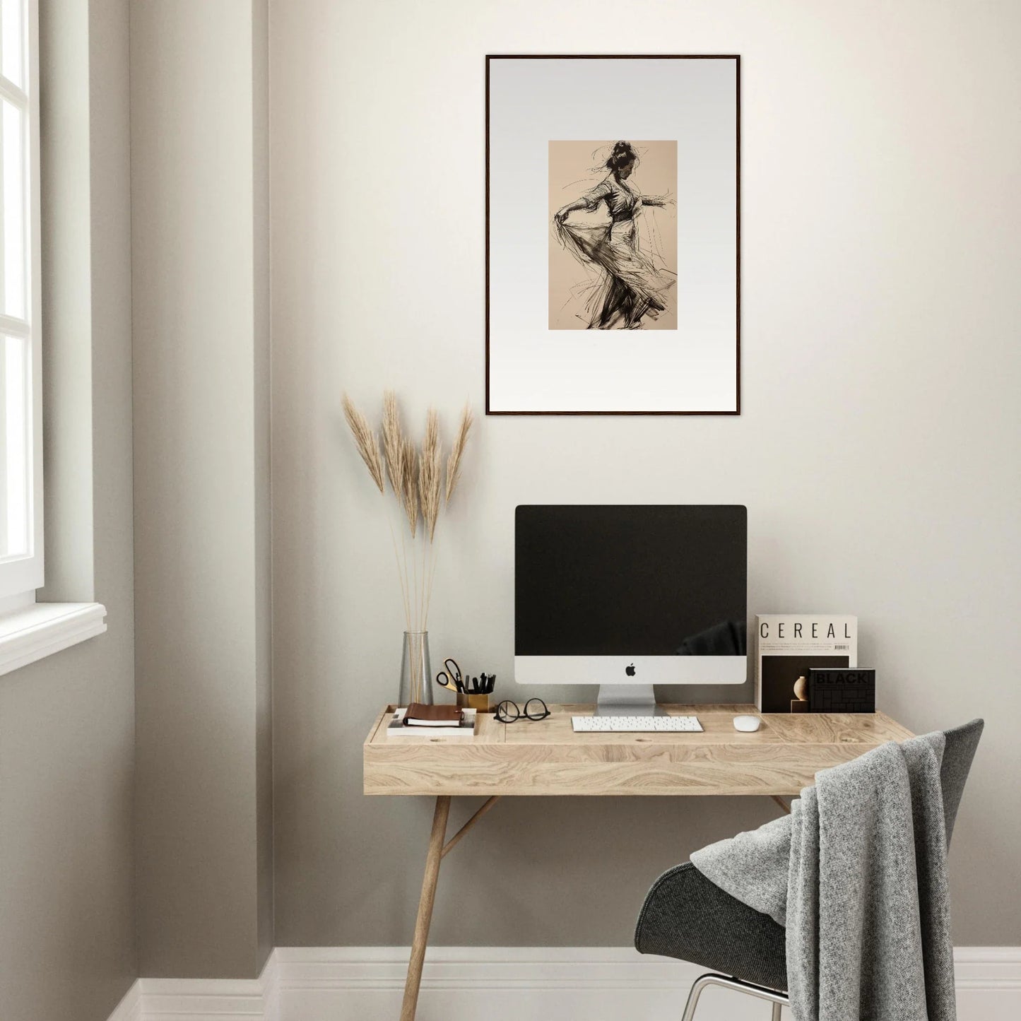 Minimalist wooden desk with iMac and decor near Ephemeral Motion Whispers art