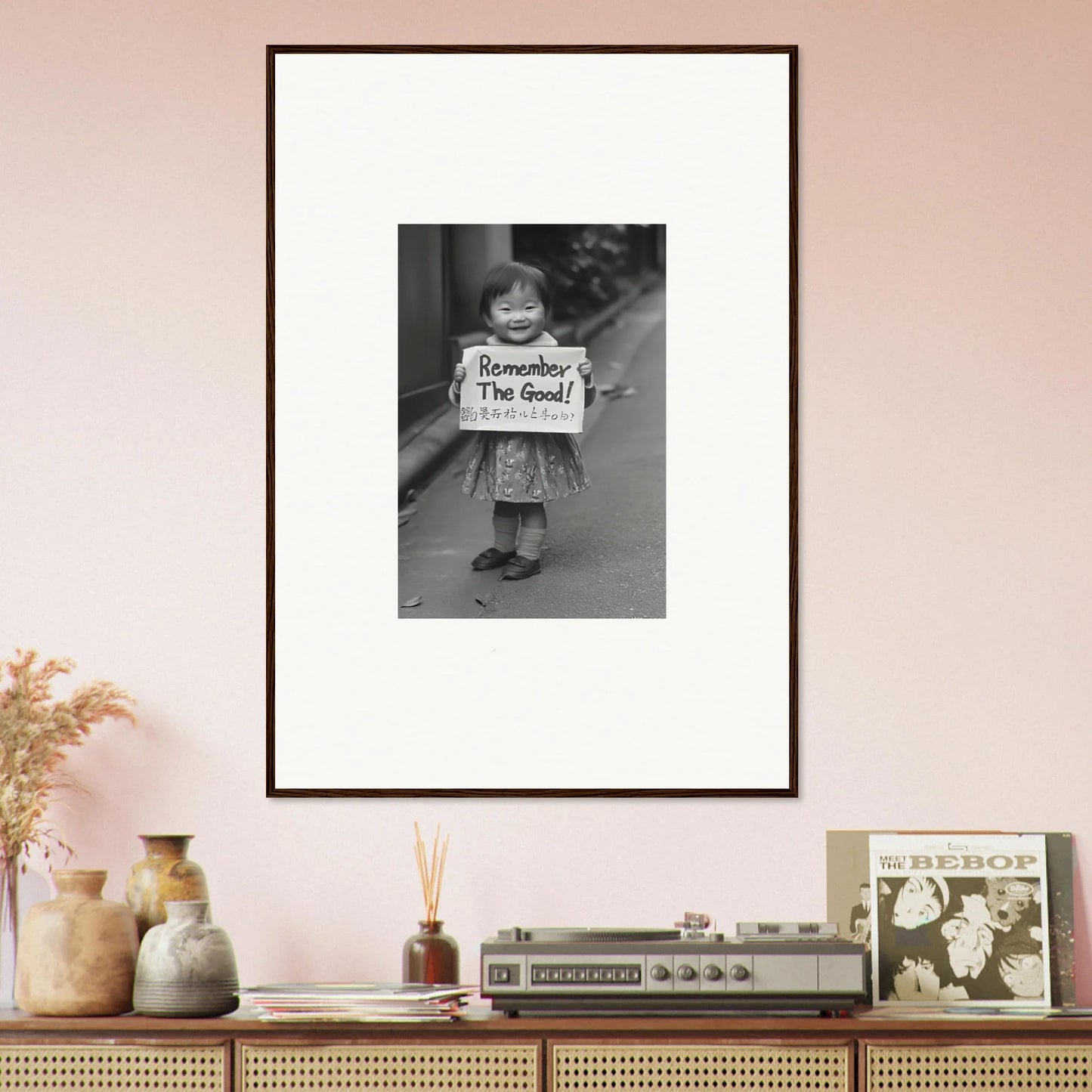 Framed black and white photo of someone with a sign saying Remember, I’m Good in Whimsy Echo Memory