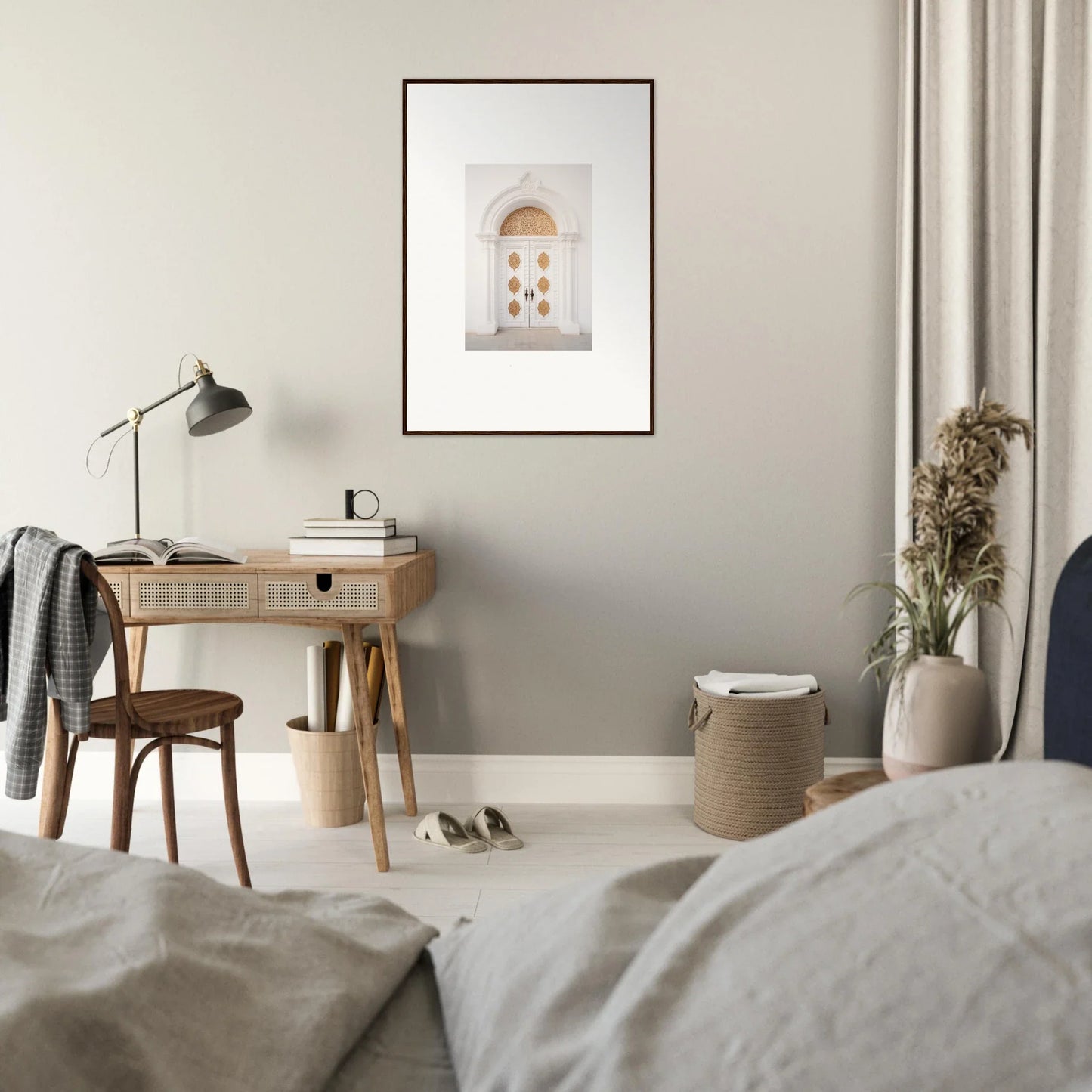 Wooden desk with a curved lamp and Gilded Mirage Passage framed wall art above it