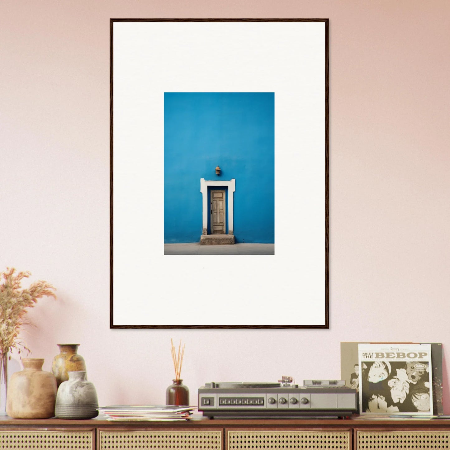 Framed photograph of a white door on a vibrant blue wall in Eternal Cerulean Cloister