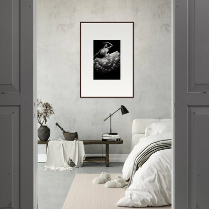 Framed black and white photograph on a light gray wall featuring Nocturnal Flourishbyen