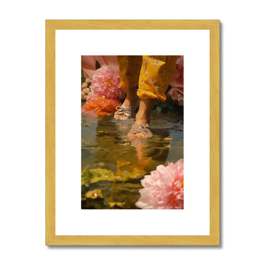 Feet standing in shallow water surrounded by pink flowers.