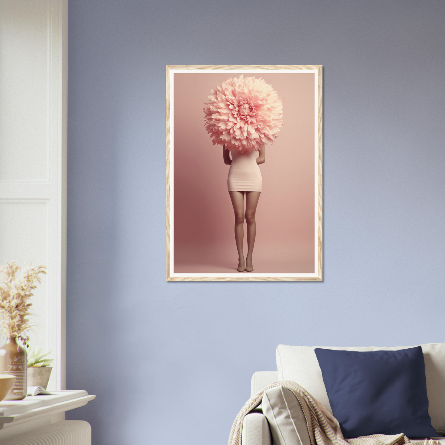 Framed artwork depicting a figure with a giant pink flower-like shape obscuring the head.