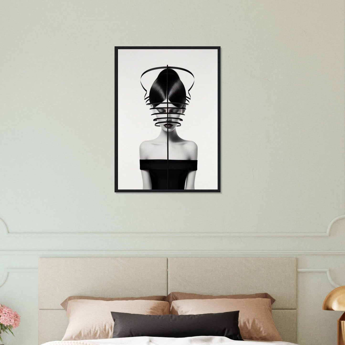 Black and white framed artwork depicting an abstract female figure with geometric elements obscuring the face.