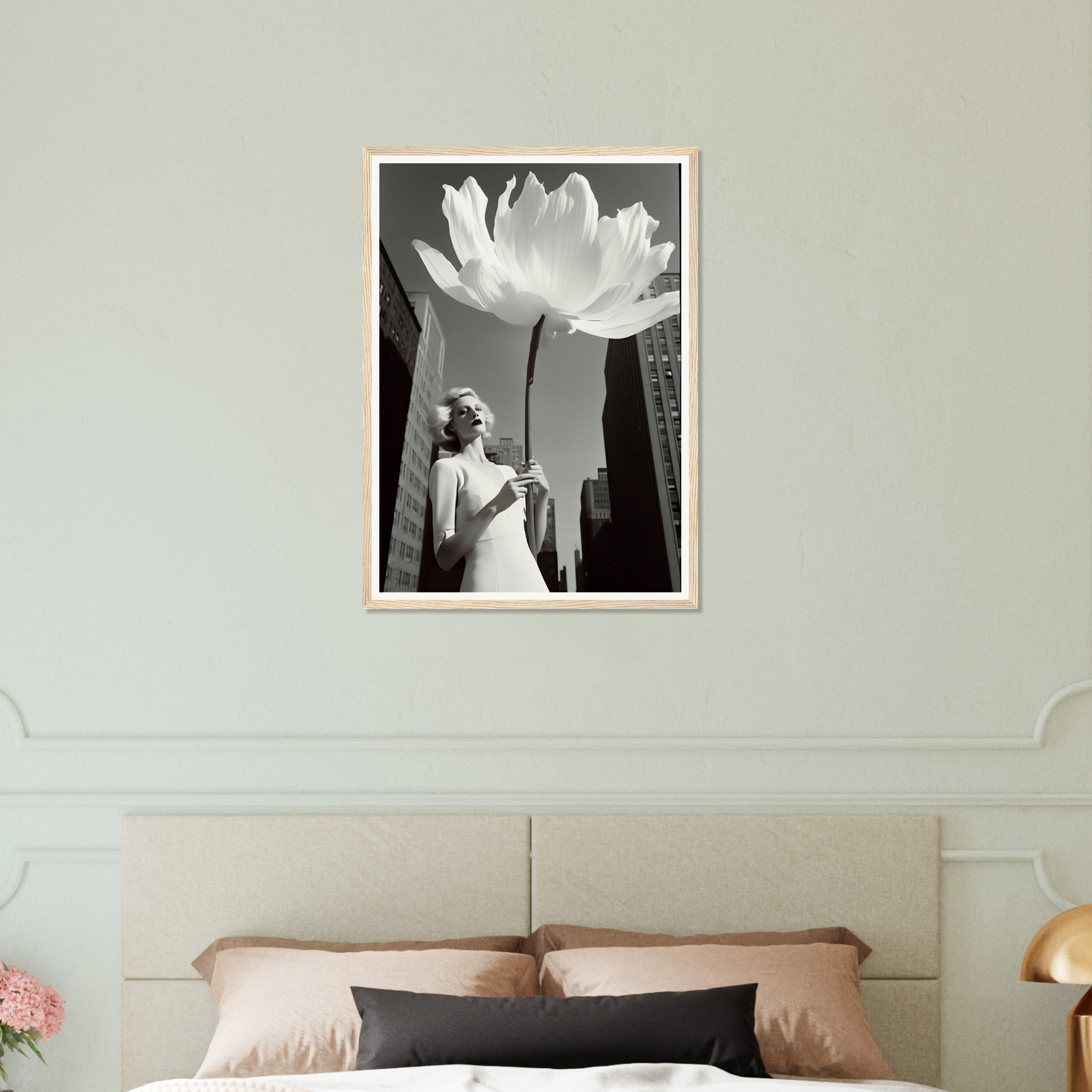 A white flower in a bedroom with a bed