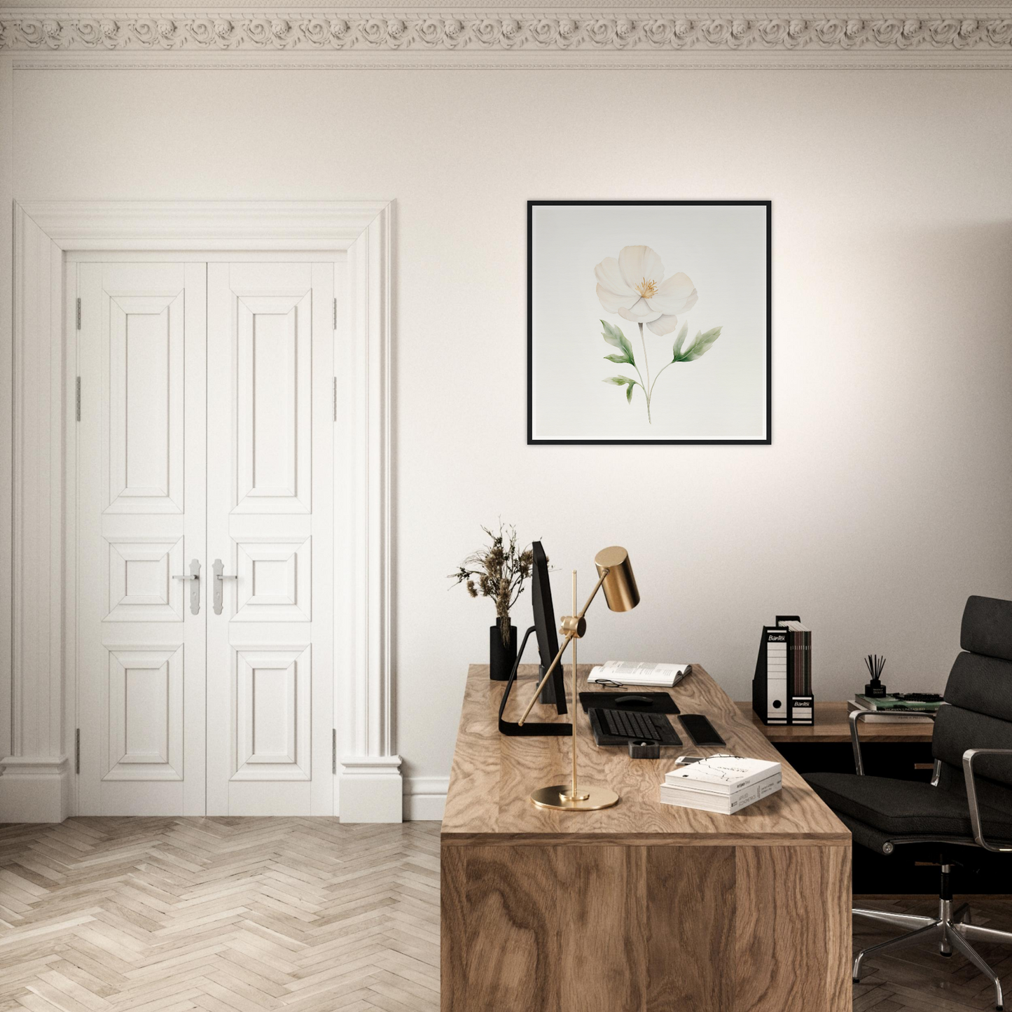 A white flower on a wall above a desk