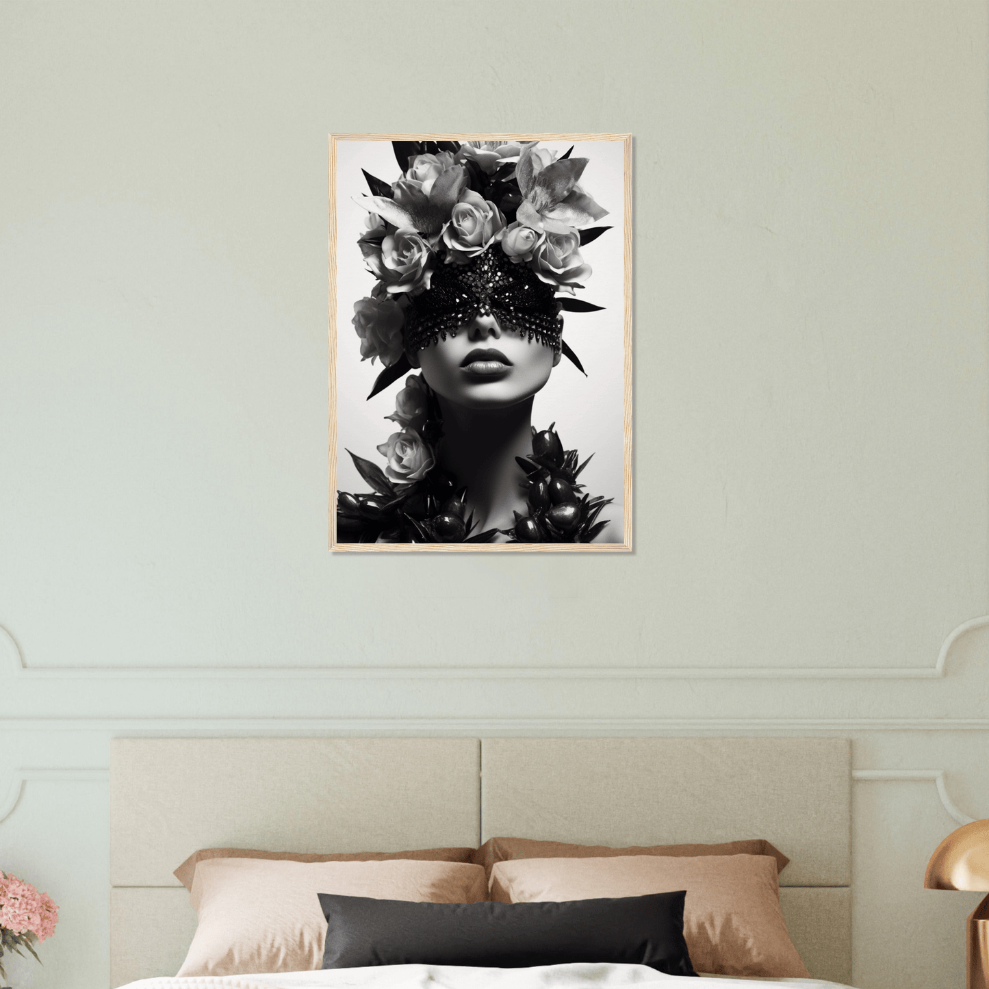 Striking black and white portrait featuring a figure adorned with floral elements and a starry eye mask.