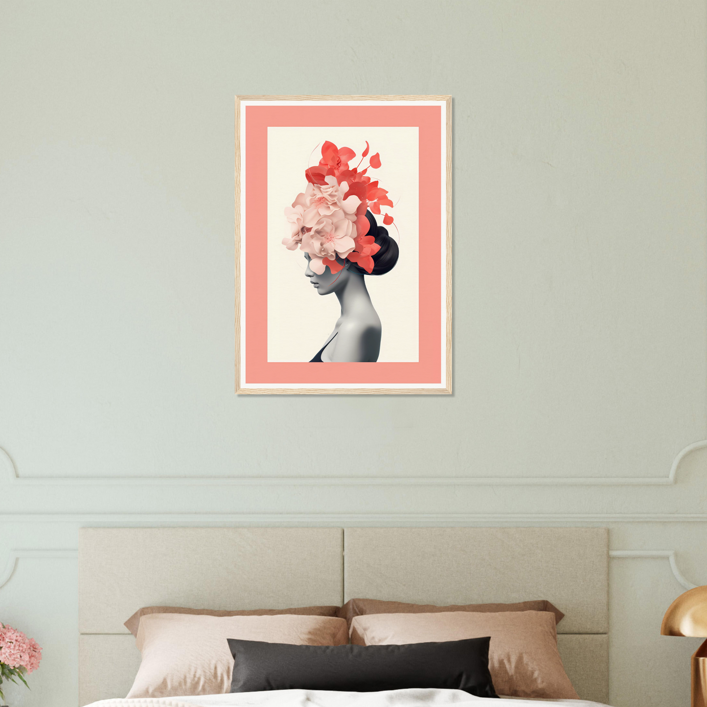 Framed artwork depicting a silhouette with floral elements atop the head.