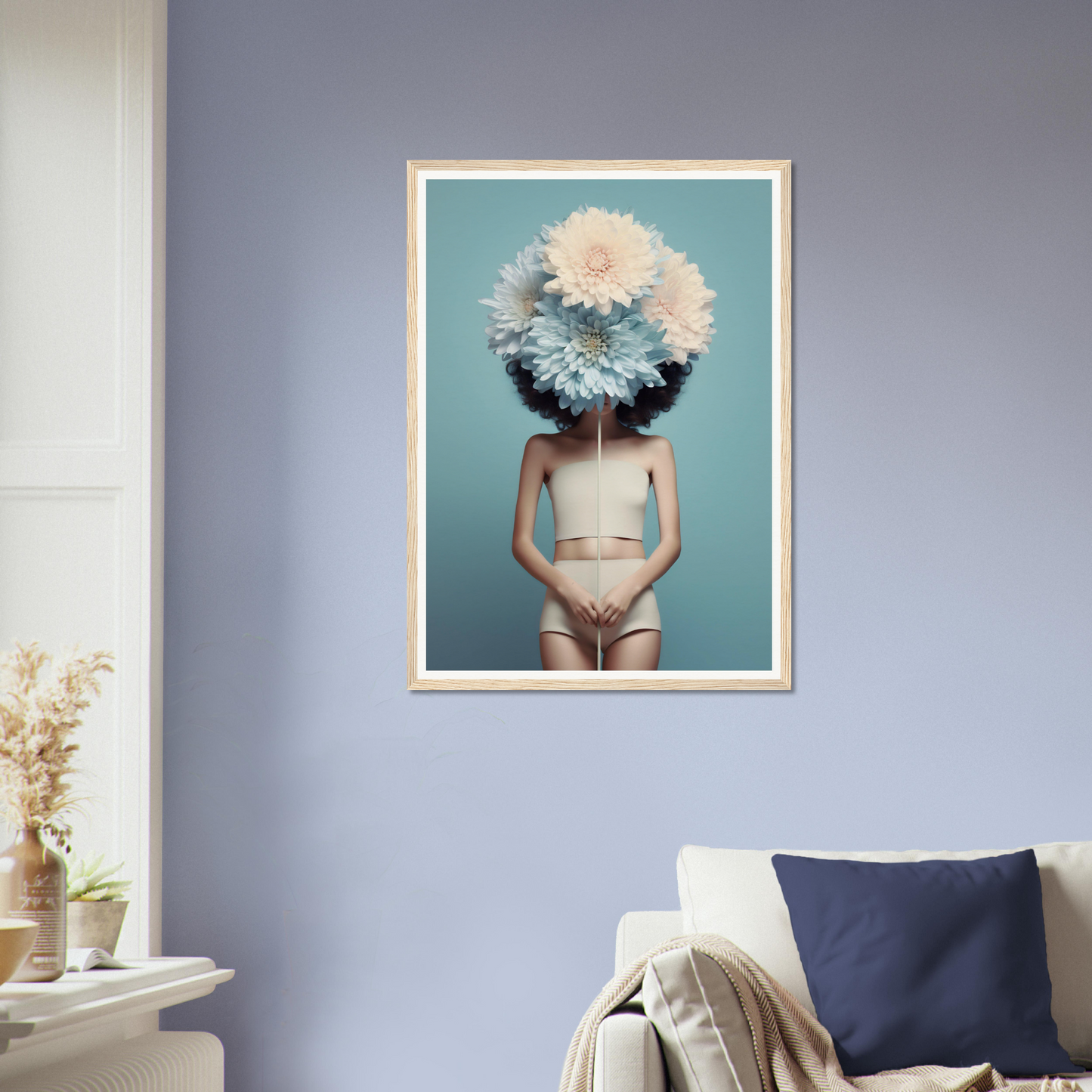 Framed surrealist artwork featuring a figure with a head obscured by white flowers, wearing minimal clothing.