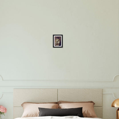 Framed photograph hanging on a white wall above a bed.