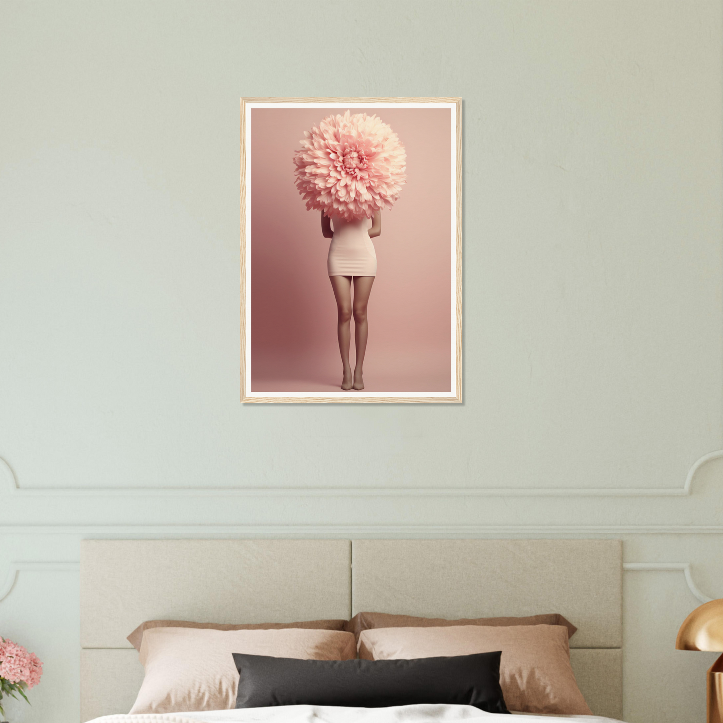 Surreal photograph of a figure with a giant pink flower in place of their head and upper body.