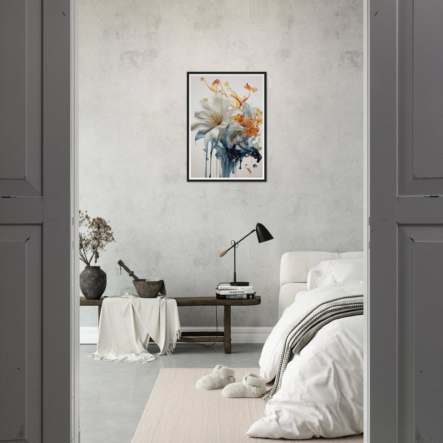 A white and orange flower in a room with a grey wall