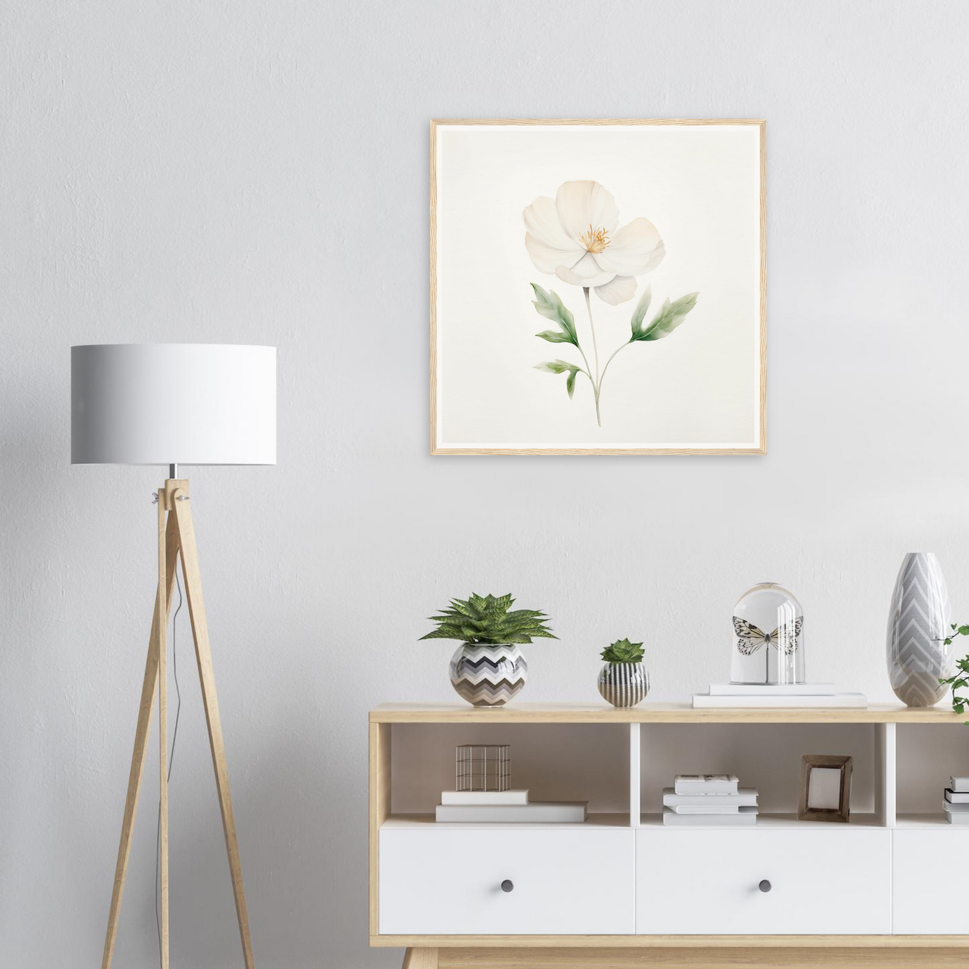 Framed watercolor painting of a single white peony flower with green leaves.