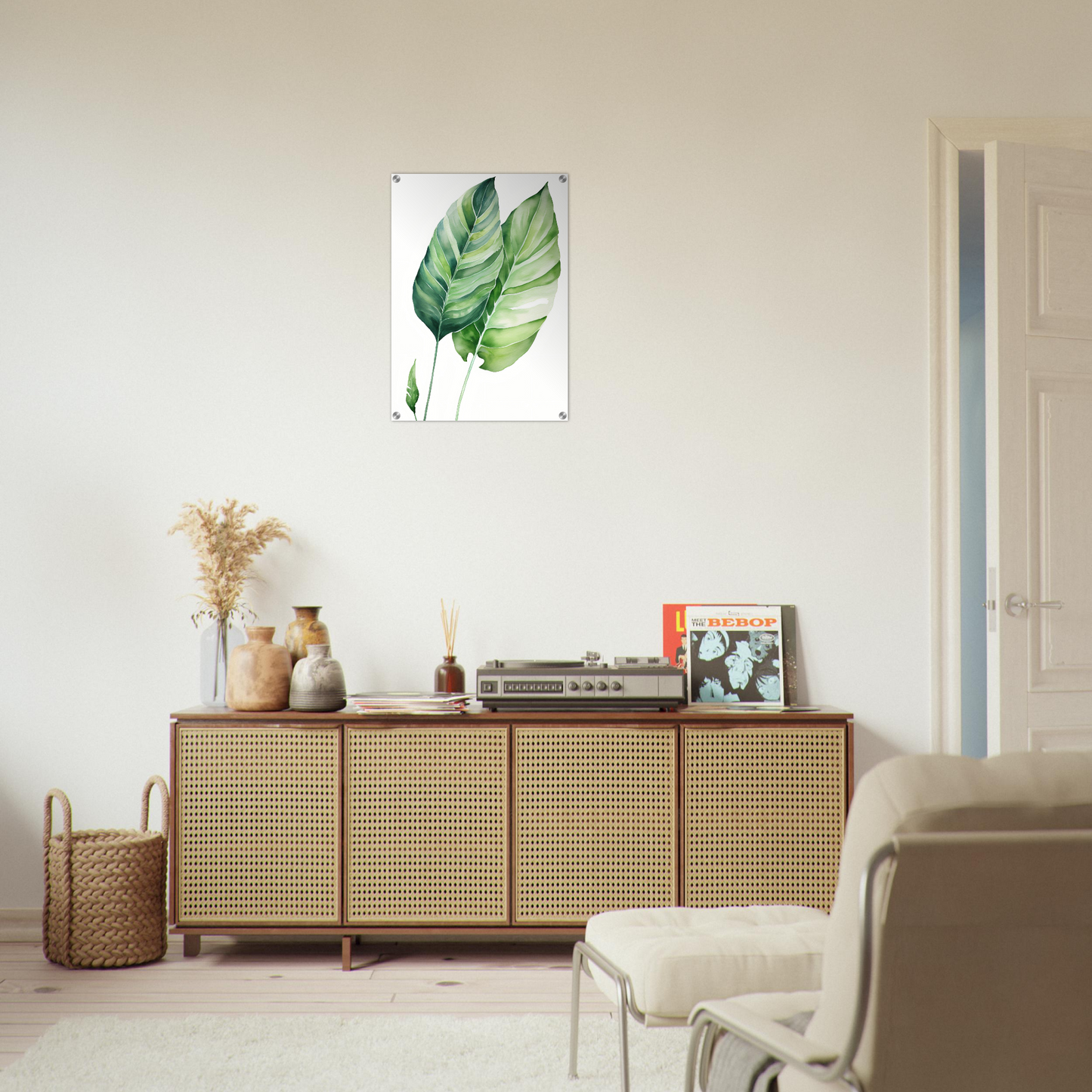 A white wall with a green leaf on it