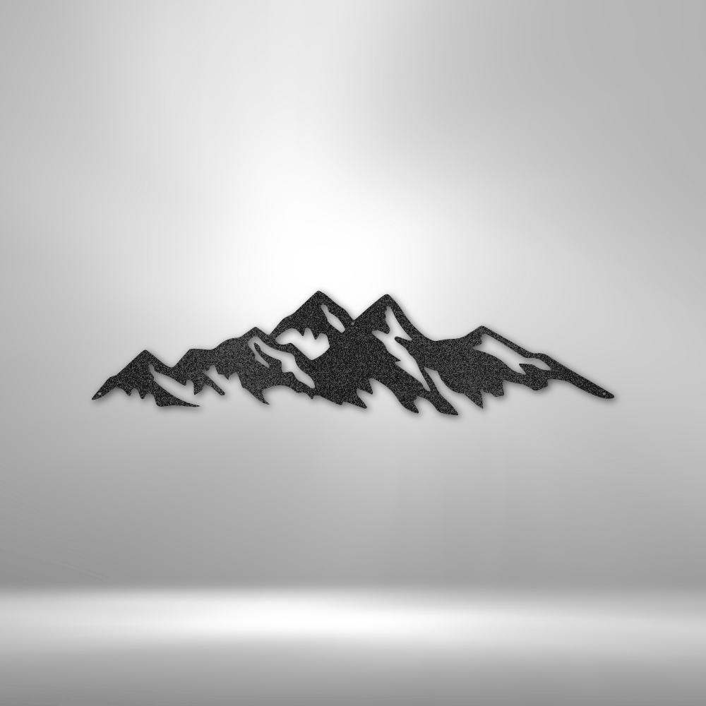 Silhouette of a mountain range with jagged peaks.