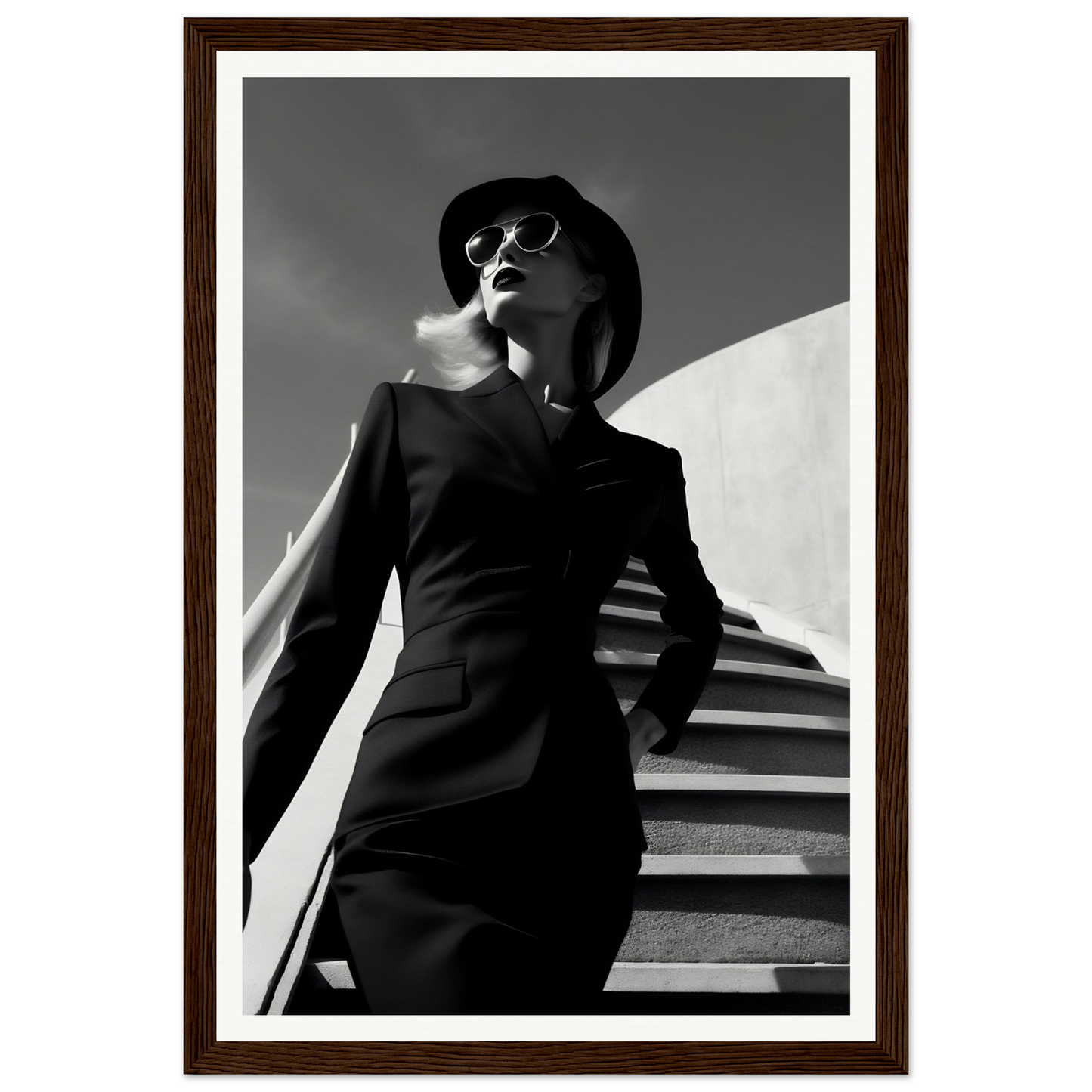 A woman in a black dress and hat standing on stairs