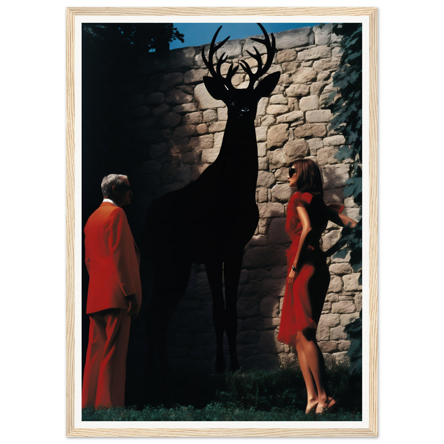 A woman in a red dress standing next to a deer