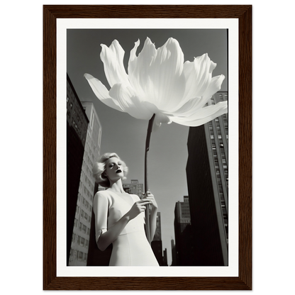 A woman in a white dress holding a large white flower