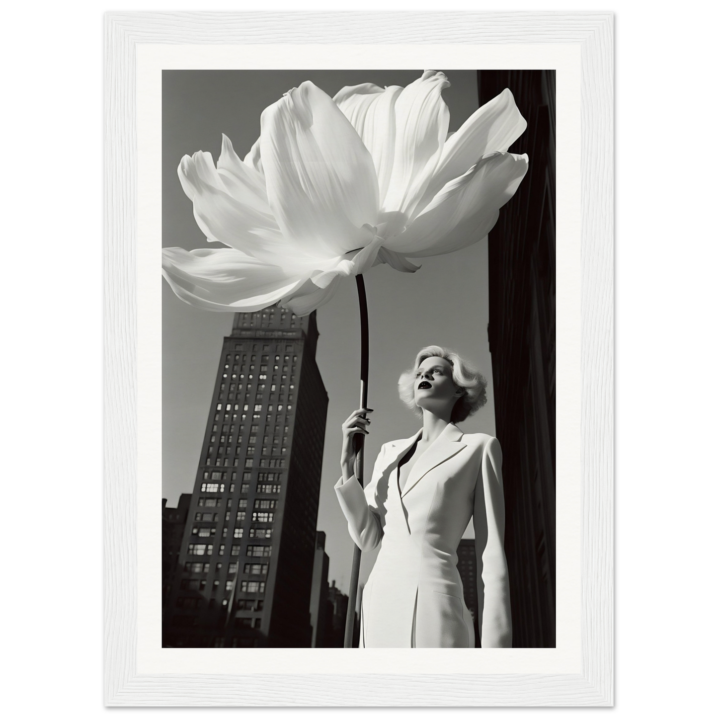 A woman in a white dress holding a large white flower