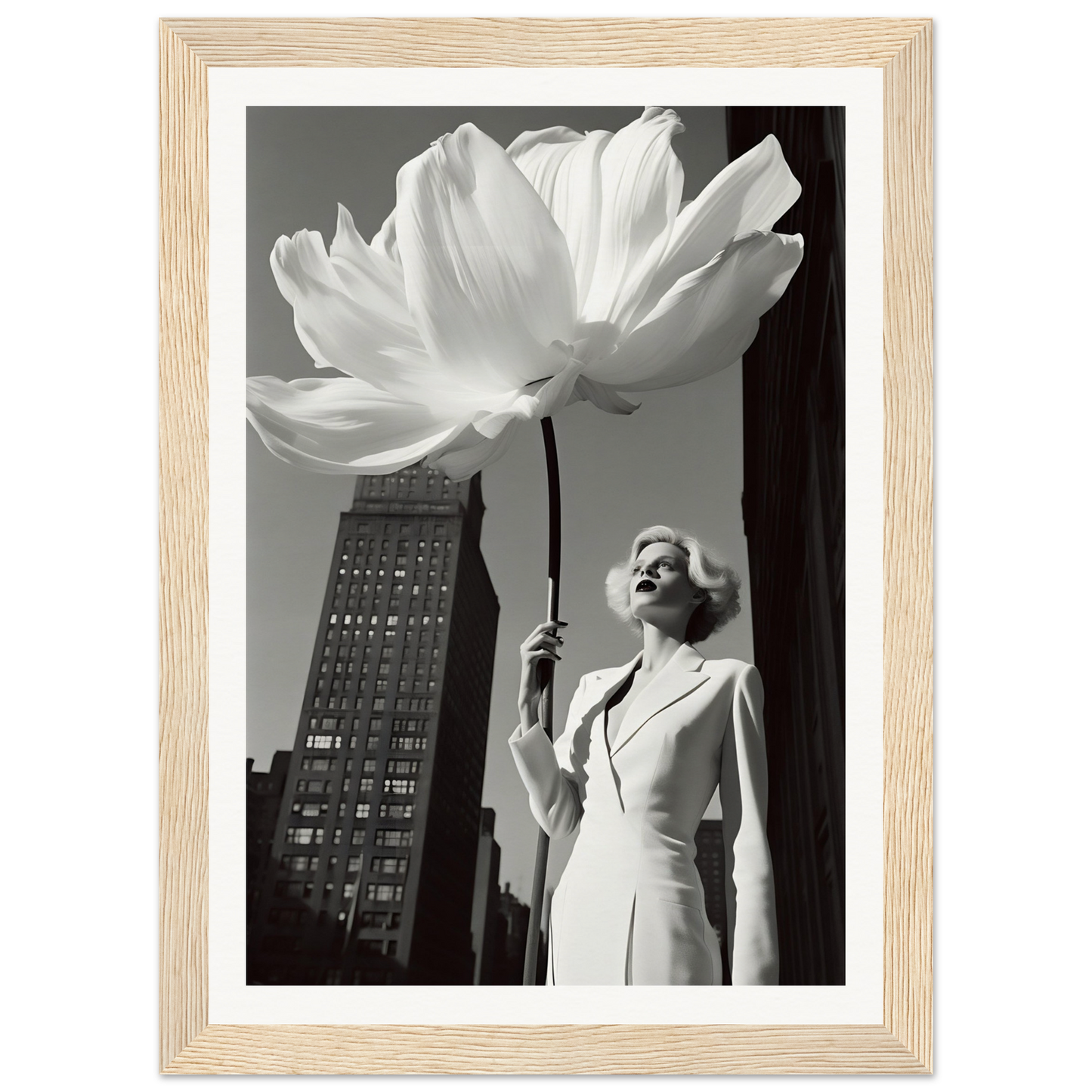 A woman in a white dress holding a large white flower