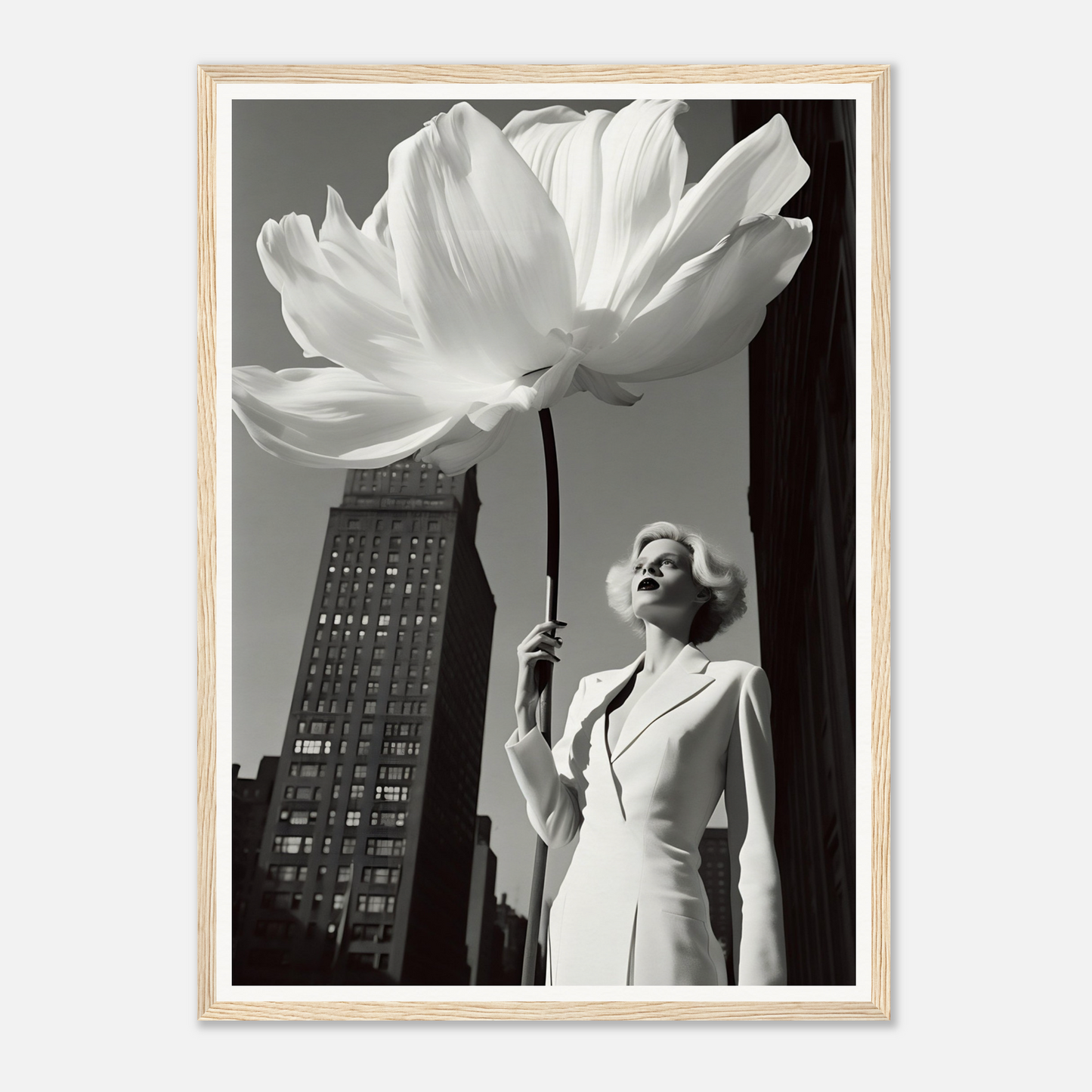 A woman in a white dress holding a large white flower