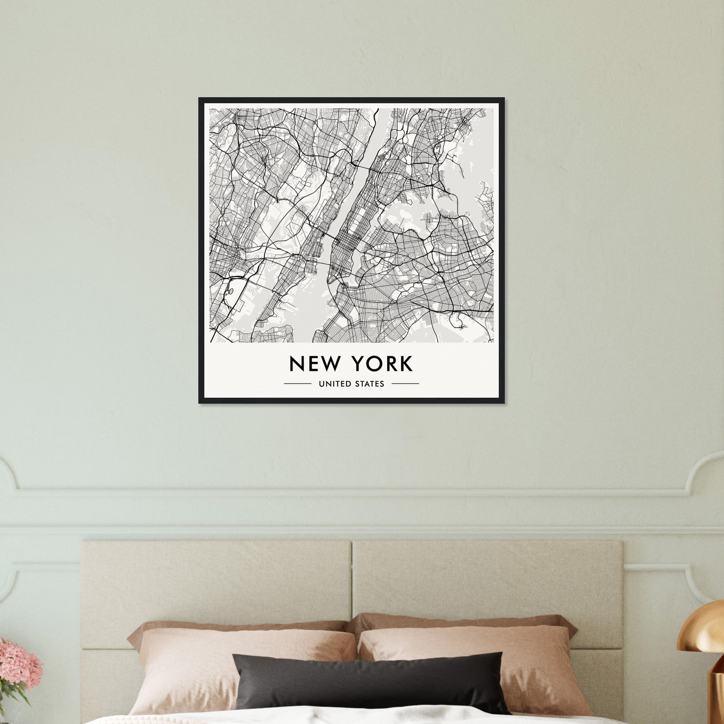 Framed map of New York City displayed on a wall.