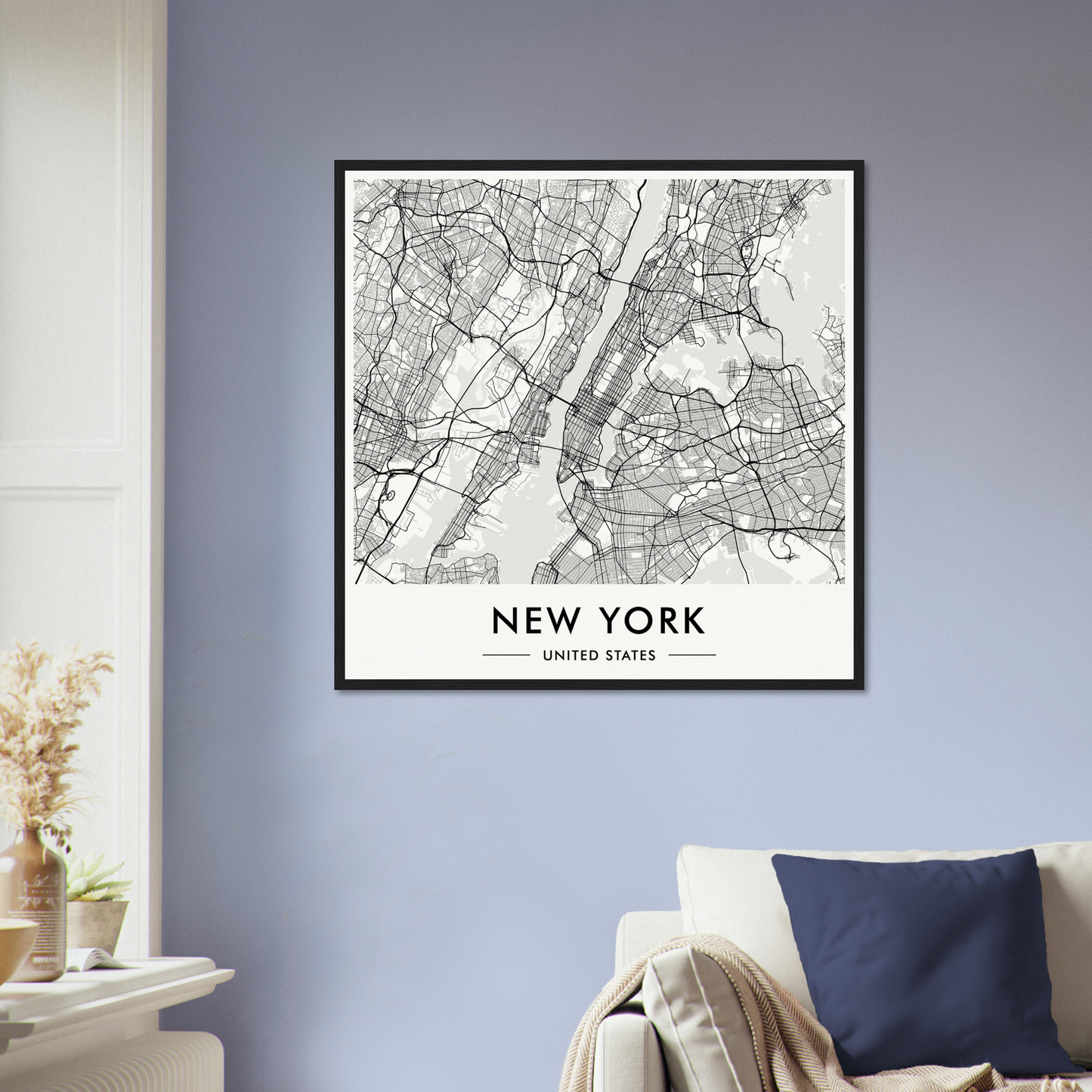 Framed map of New York City displayed on a wall.