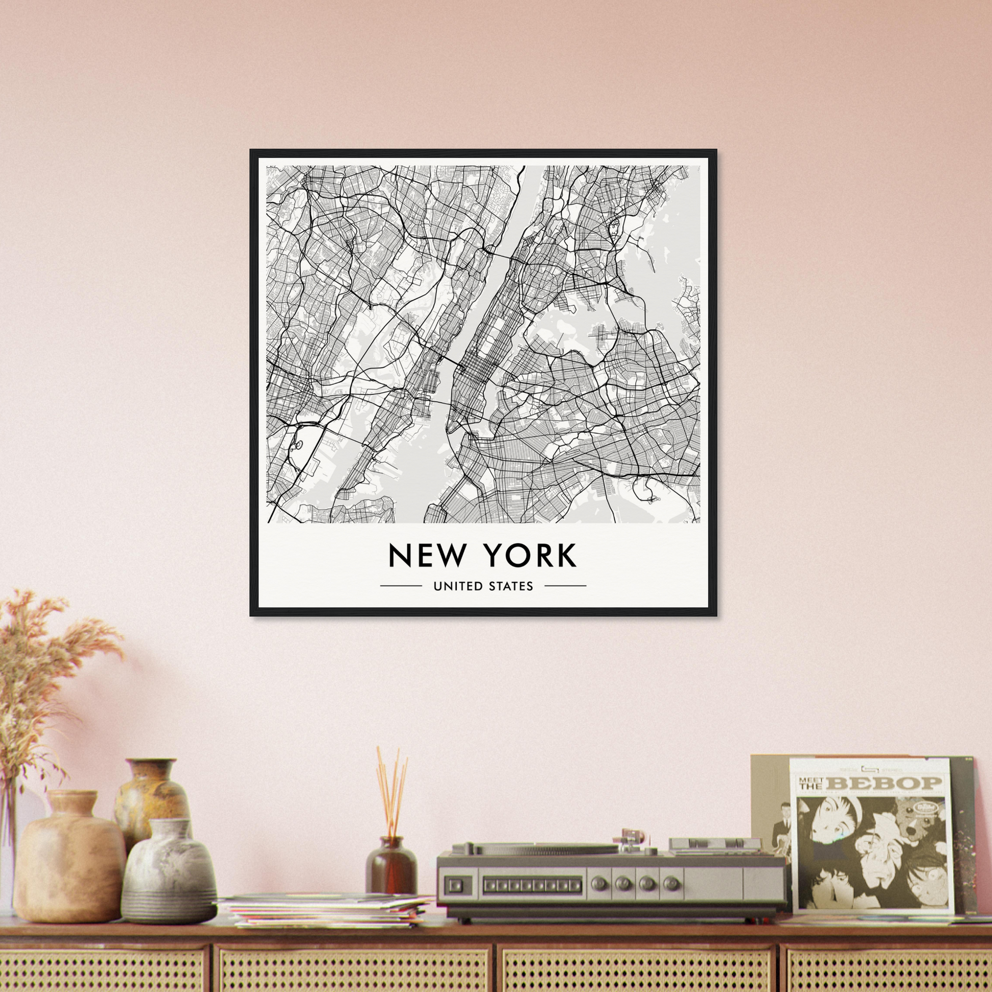 Framed map of New York City showing streets and boroughs.