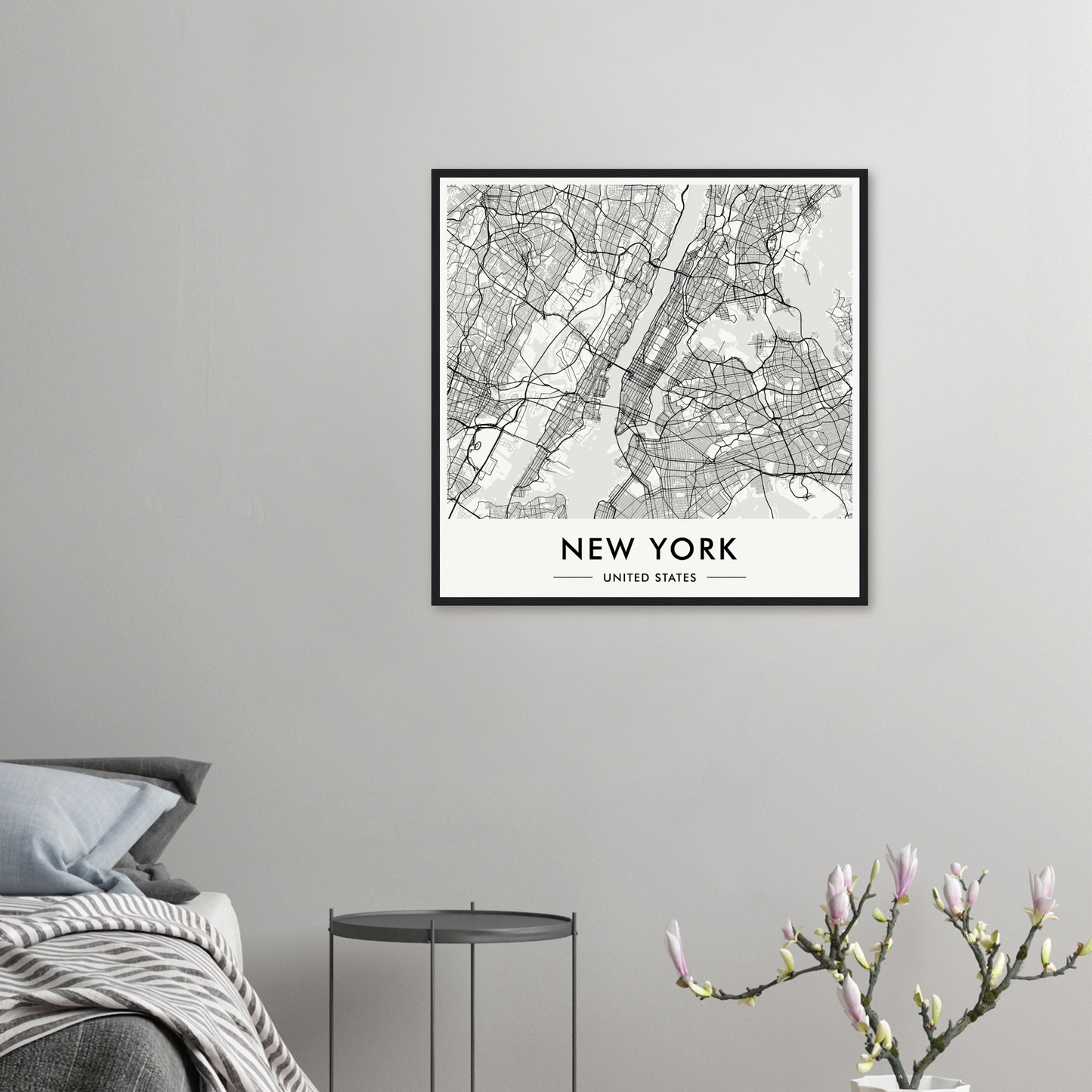 Framed map of New York City displayed on a wall.