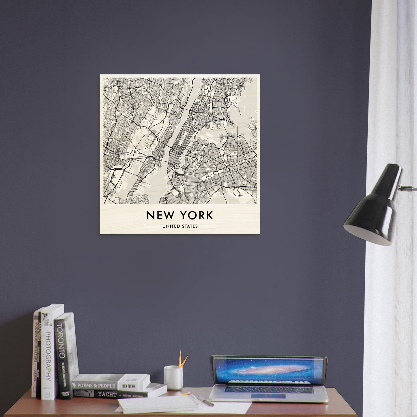 Square map artwork of New York City displayed on a wall.